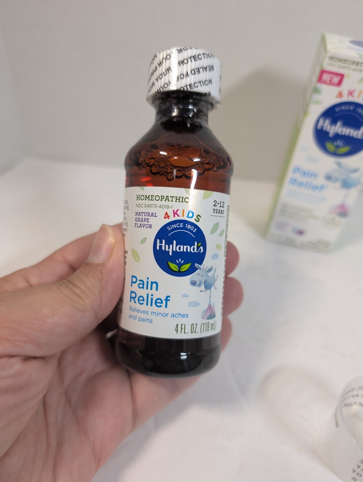 Hyland’s 4 Kids Homeopathic Pain Relief Liquid Natural Grape Flavor 4oz in Box